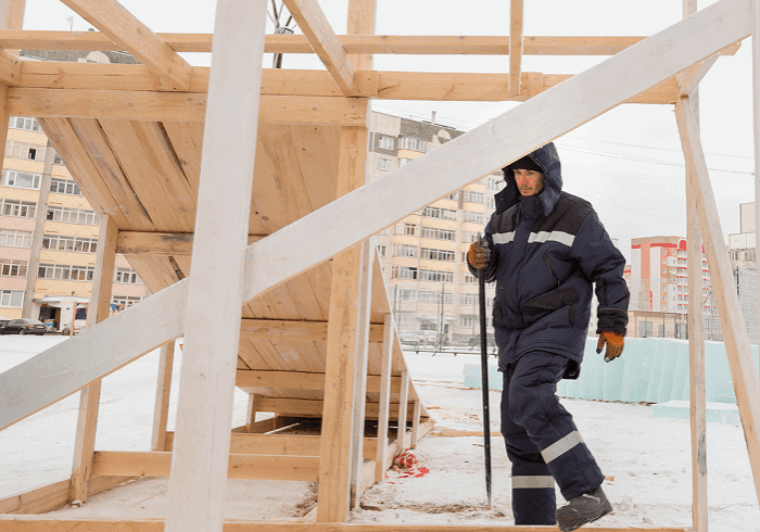 Construction worker on snowy building site